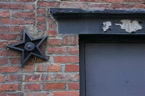 metal star on exterior of house meaning|metal stars on old buildings.